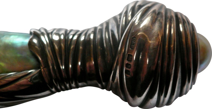 Sculptural handle of Courts and Hackett whip showing one of two large, rare, Abalone pearls.